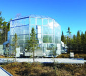 A multisided enclosure with trees in background.